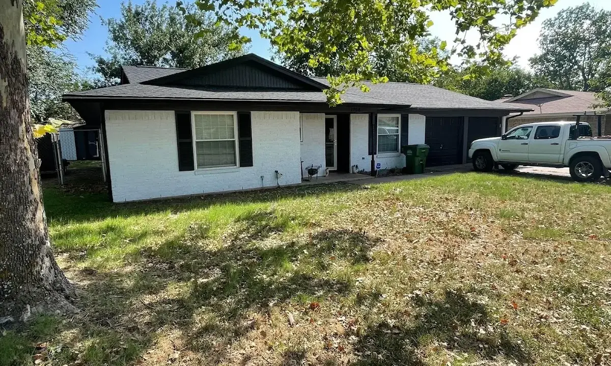 Professional roofing crew working on a residential roof in Wood Dale